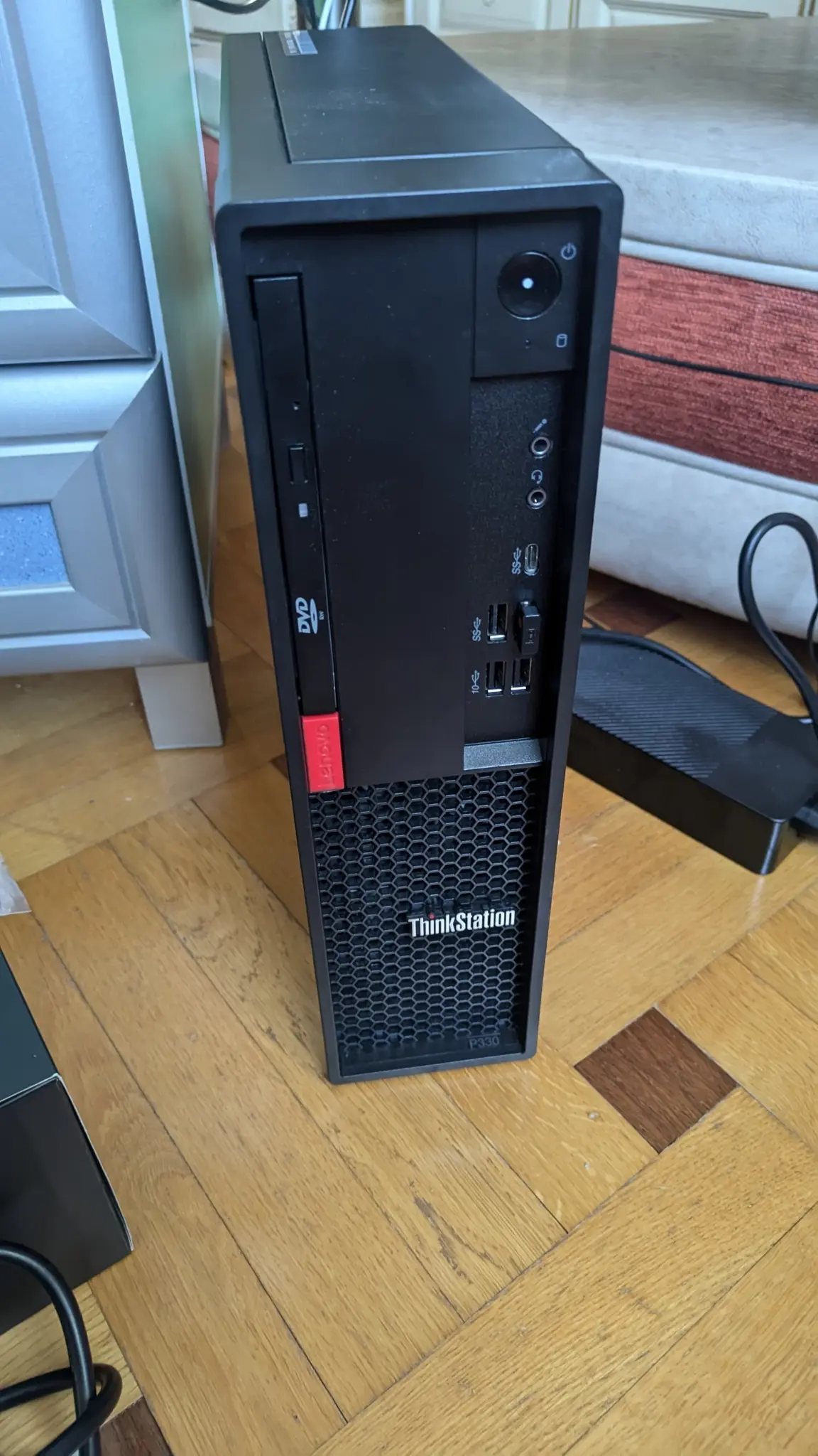 Lenovo ThinkCentre P330 SFF standing vertically. Lenovo ThinkCentre P330 SFF standing vertically.