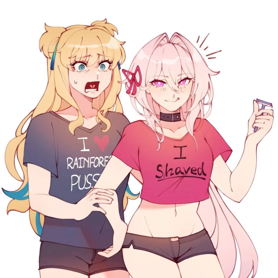 Girl wearing top with "I Shaved" written on it holding a razor in her hand and having a cheeky expression on her face. Behind her is another girl wearing t-shirt with "I ❤️ RAINFOREST PUSSY" written on it and being horrified most probably by the fact that her girlfriend had shaved.