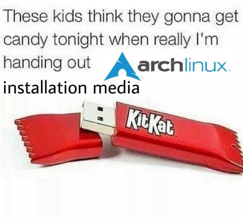 Image of a USB stick in a form of Kit-Kat branded candy. The image is captioned "These kids think they gonna get candy tonight when really I'm handing out Arch Linux installation media".